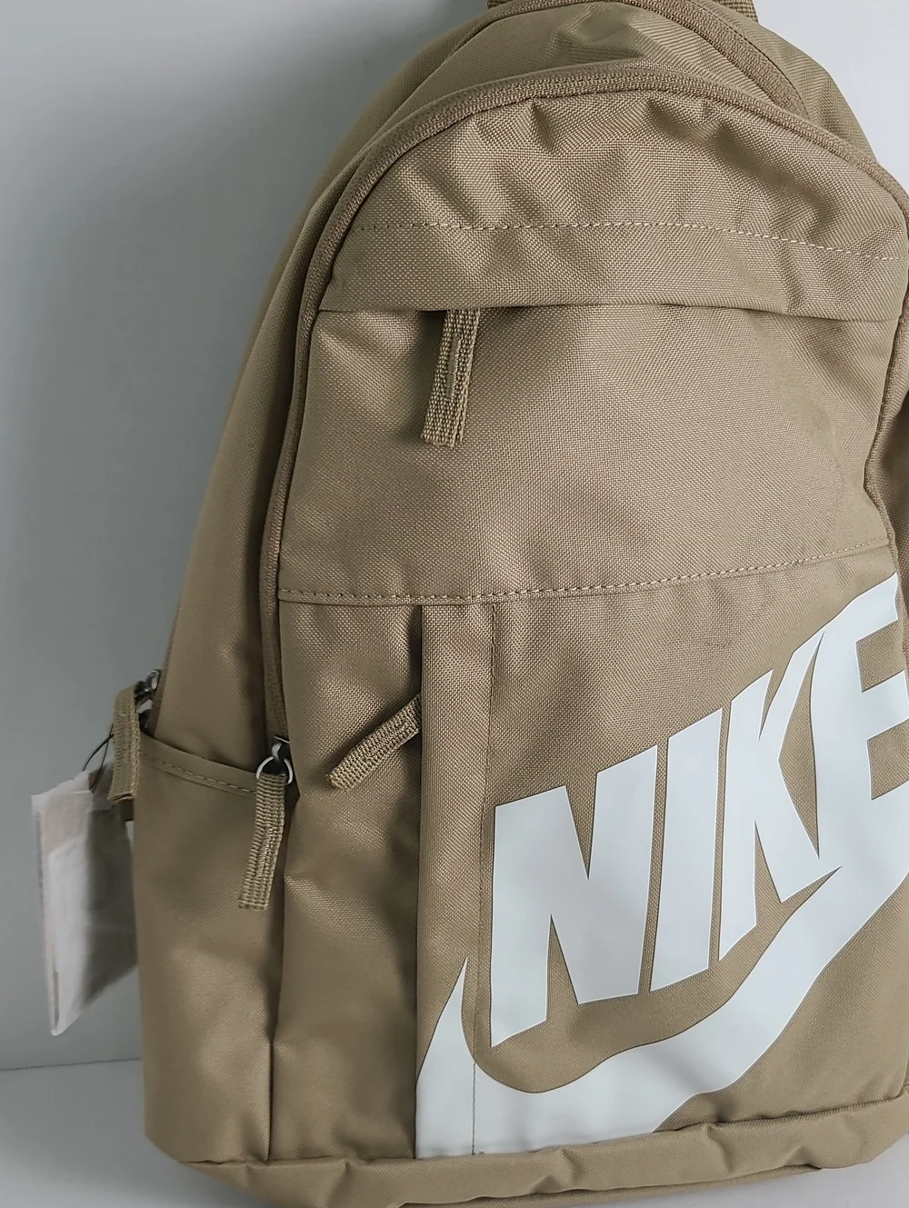 NWT NIKE Mulriple Zip Compartment Pockets Backpack Tan Beige with White Logo